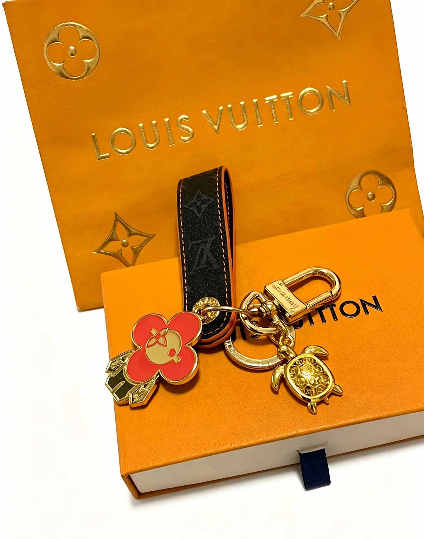 Louis Vuitton Leather Keychain with Flower and Turtle Charm